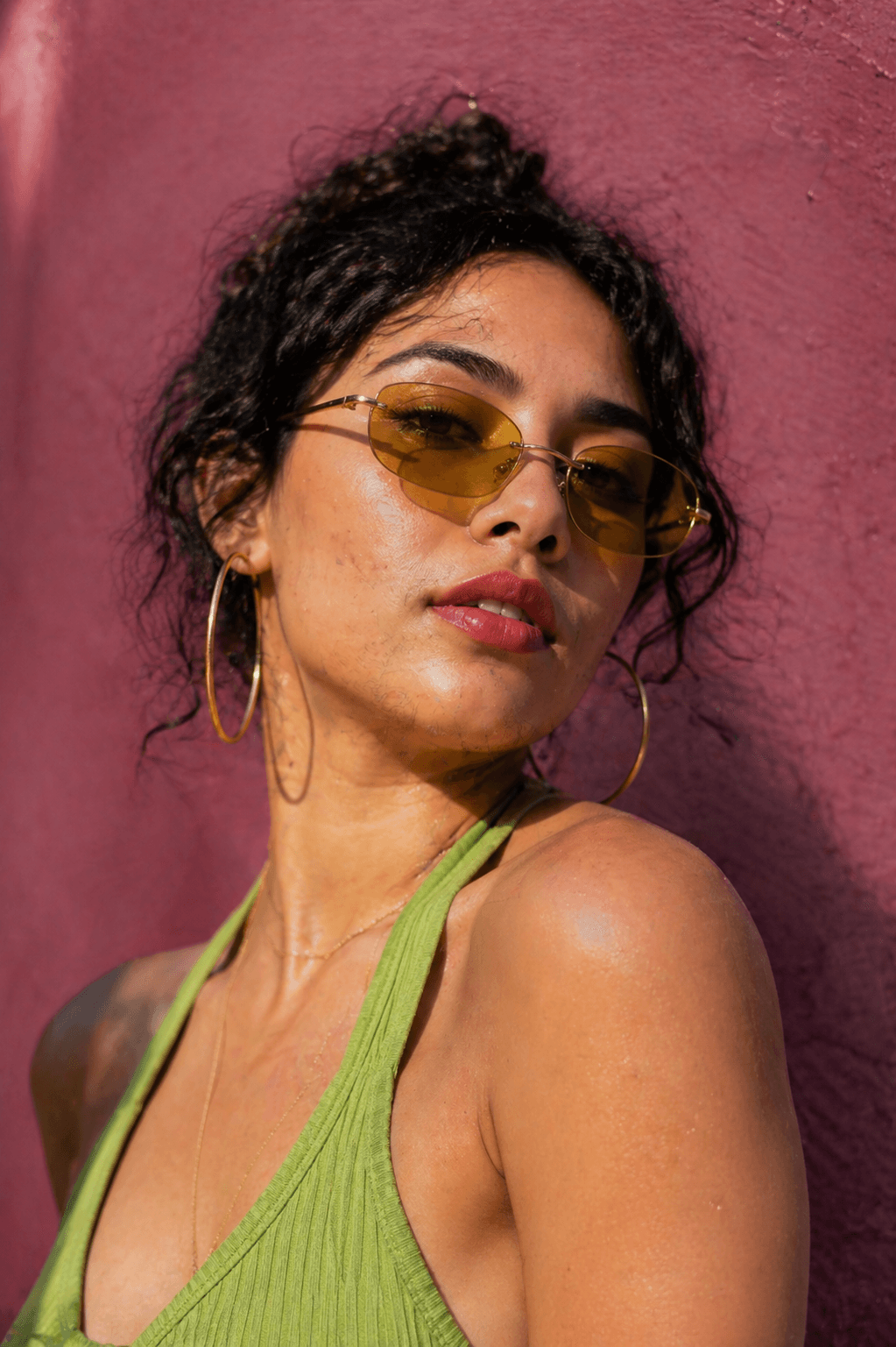 Sun-kissed skin, green top